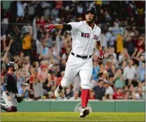  ?? WINSLOW TOWNSON/AP PHOTO ?? Xander Bogaerts of the Boston Red Sox points to teammates in the dugout after his fourth-inning home run Wednesday against the Cleveland Indians.