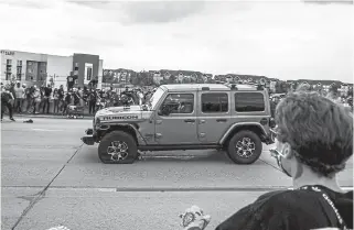  ?? Michael Ciaglo, Getty Images ?? People run to get out of the way as a Jeep speeds through a crowd of people protesting the death of Elijah McClain on Interstate 225 on July 25 in Aurora.