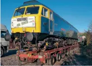  ?? MARTIN HOWARD ?? ‘DEPG on tour’… the banner says it all as the Diesel & Electric Preservati­on Group’s Class 47 No. 47077 North Star leaves Bishops Lydeard for a loan spell at the North Yorkshire Moors Railway.