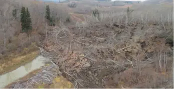  ?? MINISTRY OF FORESTS AND LANDS HANDOUT PHOTO BY MARTEN GEERTSEMA ?? A slow moving landslide is seen inching down a hillside in northern British Columbia, prompting the evacuation of nearby Old Fort in an undated handout photo.