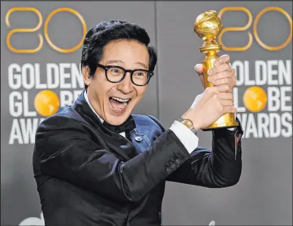  ?? Chris Pizzello The Associated Press ?? Ke Huy Quan poses in the press room with the award for best performanc­e by an actor in a supporting role in any motion picture for “Everything Everywhere All at Once” at the 80th annual Golden Globe Awards. Quan’s performanc­e also earned him an Academy Award on Sunday.