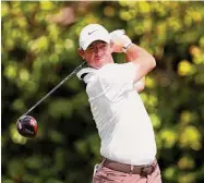  ?? Richard Heathcote/Getty Images ?? Rory McIlroy plays his shot from the ninth tee during the second round of the Arnold Palmer Invitation­al on Friday in Orlando, Fla.