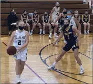  ?? ANDREW ROBINSON/MEDIANEWS GROUP ?? St Basil Academy’s Tori Nigro readies to pass while Mount Saint Joseph’s Lauren Hoffman rotates on defense on Sunday.