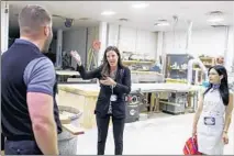  ?? BRIAN CASSELLA/CHICAGO TRIBUNE ?? Bob Tarman of Abt Electronic­s gives a tour of the Glenview store’s home theater area to health care profession­als on June 18 to teach his company’s efforts on customer satisfacti­on.