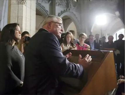  ?? Fred Chartrand/The Canadian Press via AP ?? Ralph Goodale, center, Canada’s minister of public safety and emergency preparedne­ss, and Jody Wilson-Raybould, left, that nation’s minister of justice and attorney general, hold a news conference in 2017.