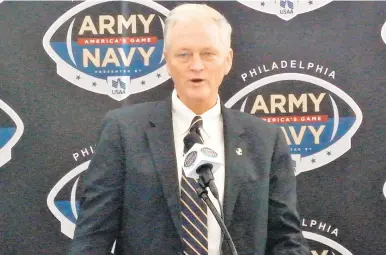  ?? COURTESY PHOTO ?? Chet Gladchuk, seen speaking ahead of the 2018 Army-Navy game press conference in Philadelph­ia, said he fully supports the Navy football coaching staff.