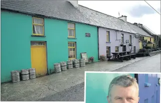  ??  ?? The pictureque village of Cloghane near Brandon point. RIGHT: Mícheál O Dowd outside his pub in Cloghane.