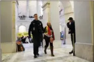  ?? JACQUELYN MARTIN - THE ASSOCIATED PRESS ?? A woman is arrested by Capitol Police after participat­ing in an act of civil disobedien­ce in support of the Deferred Action for Childhood Arrivals (DACA) program, in the Russell Rotunda, Wednesday, Feb. 7, 2018, on Capitol Hill in Washington.