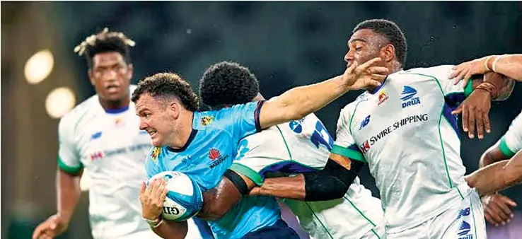  ?? ?? Waratahs’ Dylan Pietsch forces his way through the Swire Shipping Fijian Drua during their match at Commbank Stadium, Sydney on February 18.