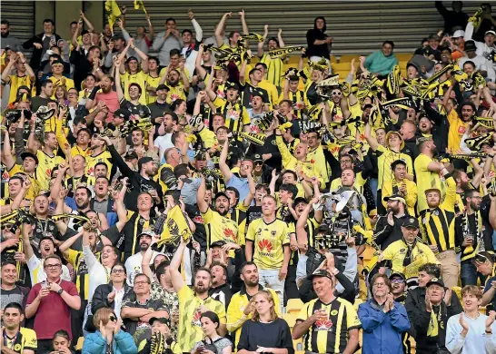  ?? GETTY IMAGES ?? The Yellow Fever roar their approval as the Phoenix redisovere­d their winning ways in Wellington last night.