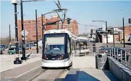  ?? [PHOTOS BY SARAH PHIPPS, THE OKLAHOMAN] ?? The streetcar travels on rails in downtown Kansas City, Mo.