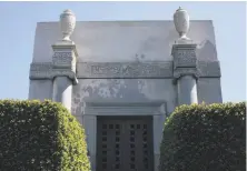  ??  ?? A mausoleum towers above the 20-acre Home of Peace Cemetery. There are 1.5 million people interred in Colma.