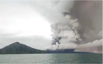  ?? — AFP photos ?? This picture shows the Anak Krakatoa volcano erupting as seen from a ship on the Sunda Straits.