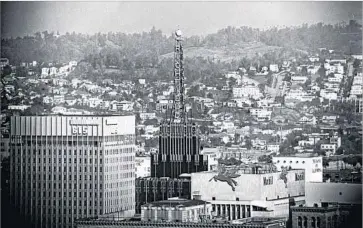  ?? Larry Sharkey Los Angeles Times ?? THE oil-derrick tower, atop the Richfield in 1965, served as a petroleum monument, The Times wrote in 2010.