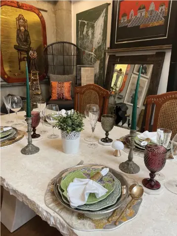  ?? ?? Clockwise: The dining area features a smorgasbor­d of vintage and contempora­ry pieces that echo Filipino touches; A family sculpture by Daniel dela Cruz; A painting by Ammiel Cagayat sits beside a Malang artwork that was gifted to her mother by the artist himself