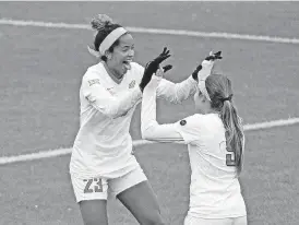  ?? WEAVER, BIG 12 CONFERENCE] [PHOTO COURTESY SCOTT ?? Oklahoma State soccer players Haley Woodard, left, and Jaci Jones celebrate during a 2-1 win over Oklahoma in the Big 12 tournament earlier this month. OSU opens NCAA tournament play at noon Saturday when Missouri State comes to Stillwater.