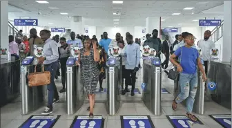  ?? ?? Passengers depart the station at Marina, a major commercial hub in Lagos.