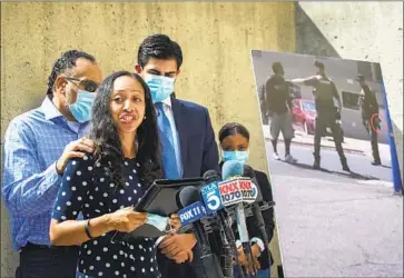  ?? Allen J. Schaben Los Angeles Times ?? LATOYA REINHOLD, widow of Kurt Reinhold, reads a statement during a 2020 news conference about her family’s wrongful-death lawsuit against the Orange County Sheriff ’s Department. The suit is ongoing.