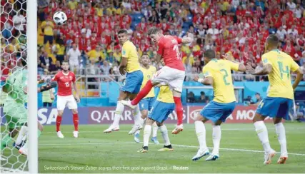  ?? — Reuters ?? Switzerlan­d’s Steven Zuber scores their first goal against Brazil.