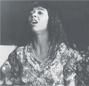 ?? ?? ↑ Irene Cara as Coco Hernandez performing at a graduation ceremony in a scene from Fame