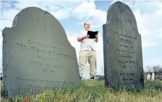  ?? ROBERT F. BUKATY/ AP FILES ?? In this April 20, 2010 file photo, Walter Skold of Freeport, Maine, reads a Henry Wadsworth Longfellow poem while posing in Eastern Cemetery in Portland, Maine. Skold, the founder of the Dead Poets Society of America who has visited the graves of more...