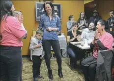  ?? Rebecca Droke/Post-Gazette ?? Sonja Finn, center, Democratic candidate for the City Council District 8 seat, with her son, Miles Finn Tinsley, 6, addresses supporters Tuesday after conceding the special election.