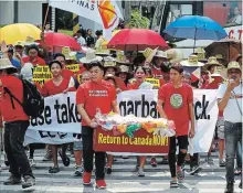  ?? BULLIT MARQUEZ THE ASSOCIATED PRESS ?? Environmen­talists march to demand the Canadian government to speed up the removal of garbage that was shipped to the Philippine­s Tuesday.