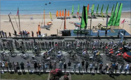  ?? PETER DEJONG — THE ASSOCIATED PRESS ?? The pack rides along the beach in La baule during the fourth stage of the Tour de France cycling race over 121 miles with start in La Baule and finish in Sarzeau, France, Tuesday, July 10.