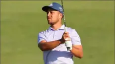  ?? Michael Reaves/Getty Images ?? Xander Schauffele hits the ball on the 18th hole at the Travelers Championsh­ip Sunday at TPC River Highlands in Cromwell, Conn.