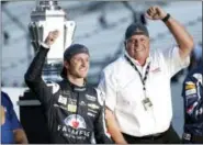  ?? THE ASSOCIATED PRESS FILE PHOTO ?? Kasey Kahne, left, with car owner Rick Hendrick after winning the NASCAR Brickyard 400.