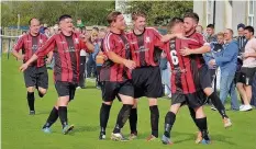  ??  ?? Llannerchy­medd celebrate a Matthew Jones goal against Mynydd Llandegai