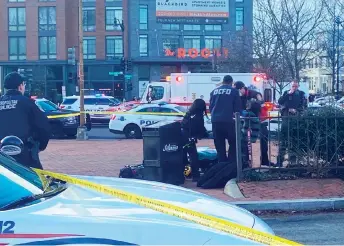  ?? Washington Post photo by Katie Mettler — ?? Authoritie­s at the Potomac Avenue Metro station in Southeast Washington, where the shooting took place.