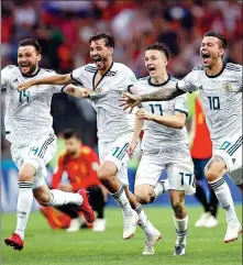  ?? REUTERS ?? From left: Russia’s Vladimir Granat, Aleksandr Erokhin, Aleksandr Golovin and Fyodor Smolov are overjoyed after their team’s last-16 victory.