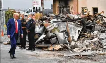  ?? MANDEL NGAN / AFP VIA GETTY IMAGES / TNS ?? President Donald Trump tours an area affected by civil unrest in Kenosha, Wisconsin, on Tuesday. The city has seen protests since the police shooting of Jacob Blake.