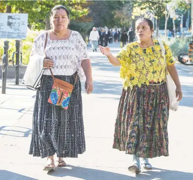  ?? PETER J THOMPSON / FINANCIAL POST ?? Angelica Choc, left, and Irma Yolanda Choc Cac arrive at the courthouse in Toronto on Tuesday.