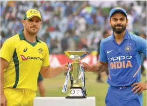  ?? Photo: Times of India ?? From left Australian cricket team captain Aaron Finch and Indian team captain Virat Kohli.