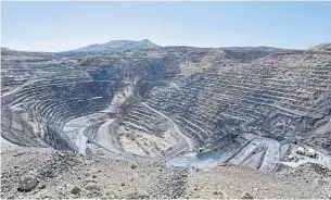  ?? DAVID B. PARKER THE ASSOCIATED PRESS FILE PHOTO ?? The Newmont Gold Quarry pit in Battle Mountain, Nev. Barrick Gold Corp., the world’s second-largest gold producer, might partner with a firm such as Newcrest, to make deal work.