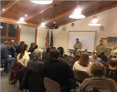  ?? PHOTO BY LISA SCHEID — MEDIANEWS GROUP ?? French Creek State Park Operations Manager James Wassell welcomes visitors Wednesday night, Dec. 11, to a public session on a draft state park plan.