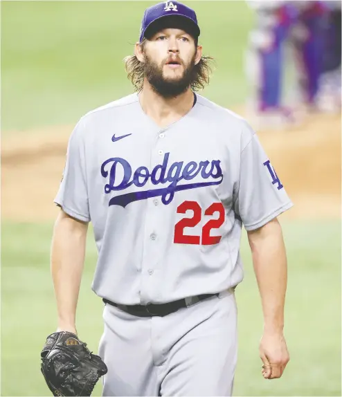  ?? Tom Pennington / Getty Imag es ?? For the first time in his stellar career, Los Angeles Dodgers left-hander Clayton Kershaw made his first two starts
of a World Series without taking the loss. Kershaw was brilliant in Game 1 and went 52/3 innings in Game 5.