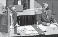  ?? Court TV / Associated Press ?? Defense attorney Eric Nelson, left, and defendant and former Minneapoli­s police officer Derek Chauvin listen as Hennepin County Judge Peter Cahill discusses pretrial motions.