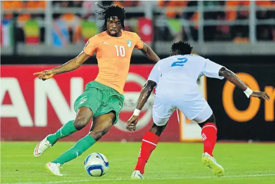  ??  ?? Ivory Coast forward Gervinho, left, in action against DR Congo in the semi-final.