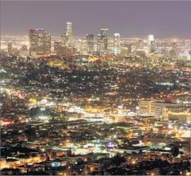  ?? Francine Orr Los Angeles Times ?? A LIT-UP Los Angeles at night. Half of Europe and a quarter of North America have experience­d seriously modified light-dark cycles, researcher­s say.