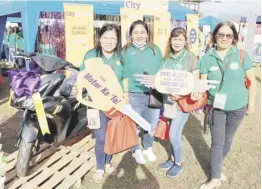  ?? ?? TEACHERS from the Cordillera Administra­tive Region who joined the National Teachers’ Day celebratio­ns last 5 October in Bangued, Abra pose by the motorcycle display at the CitySaving­s booth. Motorcyle units were among the many raffle prizes sponsored by CitySaving­s.