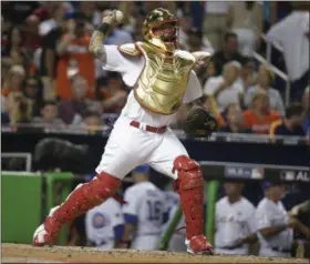  ?? LYNNE SLADKY — THE ASSOCIATED PRESS ?? National League’s St. Louis Cardinals catcher Yadier Molina (4), throws during the sixth inning at the MLB baseball All-Star Game on July 11 in Miami.
