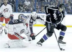  ?? CHRIS O’MEARA/AP FILES ?? Tampa Bay centre Brian Boyle takes a pass in front of Columbus last month. The Toronto Maple Leafs have plugged a year-long hole at the fourth-line centre spot, swinging a trade with the Lightning for Boyle on Monday.