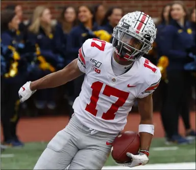  ?? PAUL SANCYA — THE ASSOCIATED PRESS ?? Ohio State’s Chris Olave celebrates a touchdown reception against Michigan in 2019.