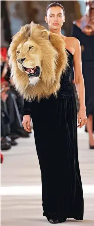  ?? ?? Weird but wonderful: From left, a Schiaparel­li winged dress, Irina Shayk in the label’s lion gown, and a bold lacey design