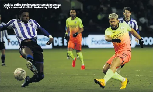  ??  ?? Decisive strike: Sergio Aguero scores Manchester City’s winner at Sheffield Wednesday last night
