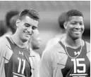  ?? JOE ROBBINS/GETTY ?? Quarterbac­ks Marcus Mariota, left, and Jameis Winston get together during the 2015 NFL Scouting Combine at Lucas Oil Stadium in Indianapol­is on Feb. 21. Both quarterbac­ks have struggled during their NFL careers.