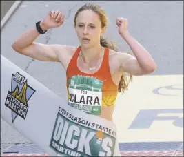  ??  ?? Clara Santucci wins the women’s division of the Pittsburgh Marathon with a time of 2:34:06.